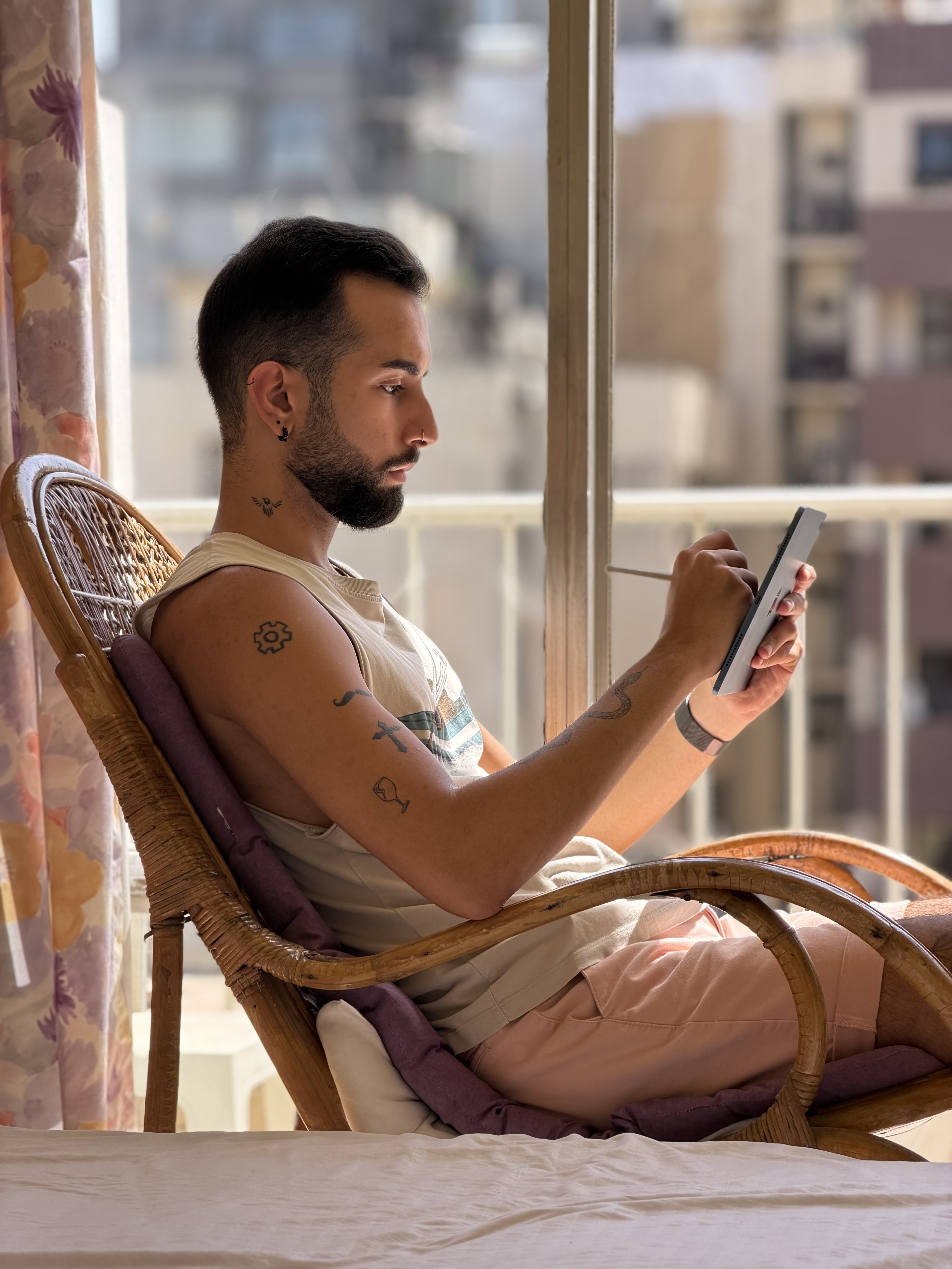 Picture of a person writing with an Apple Pencil taken  with the iPhone 17 Pro Max at 4x telephoto