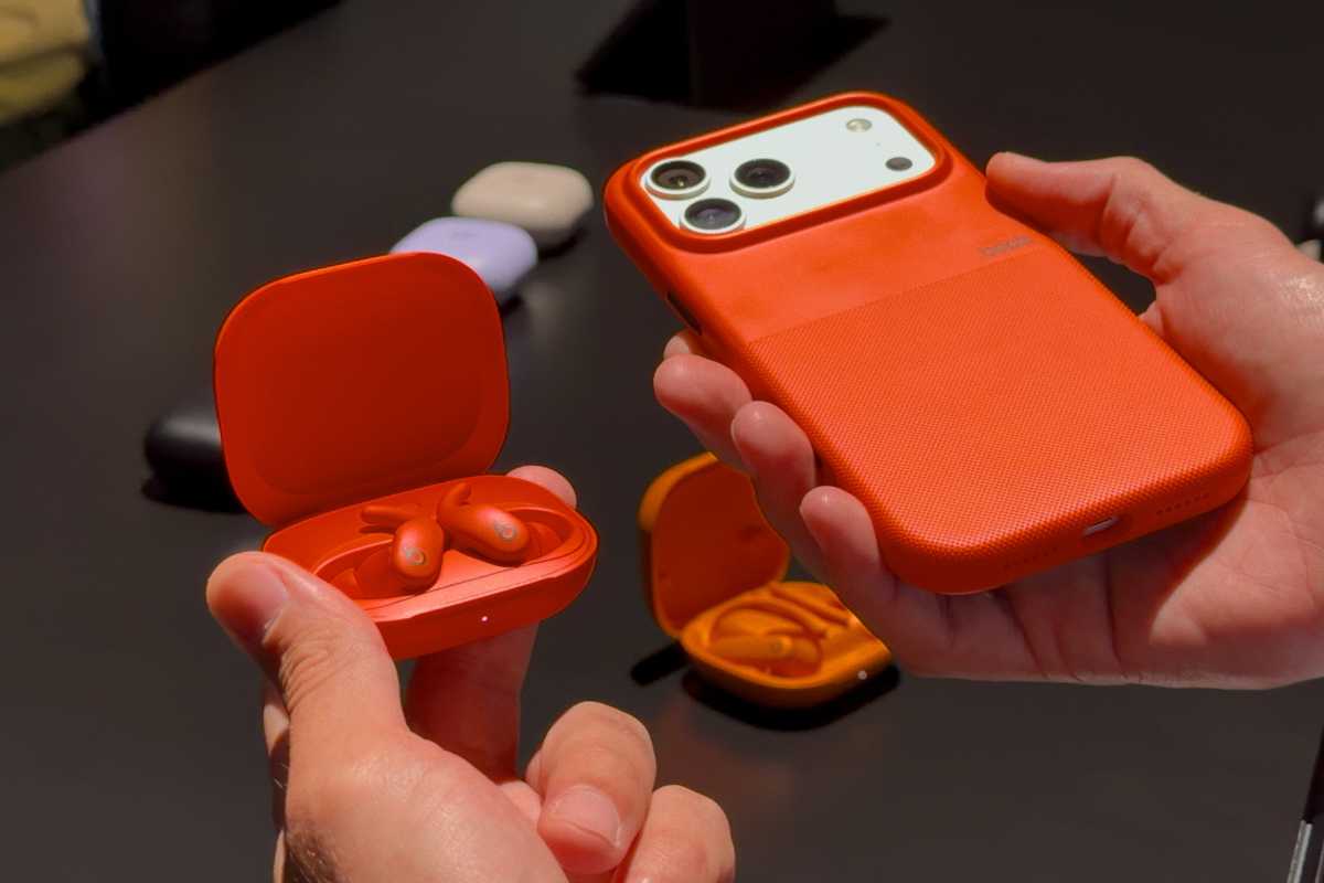 Orange Beats case on iPhone 17 Pro with Powerbeats Fit