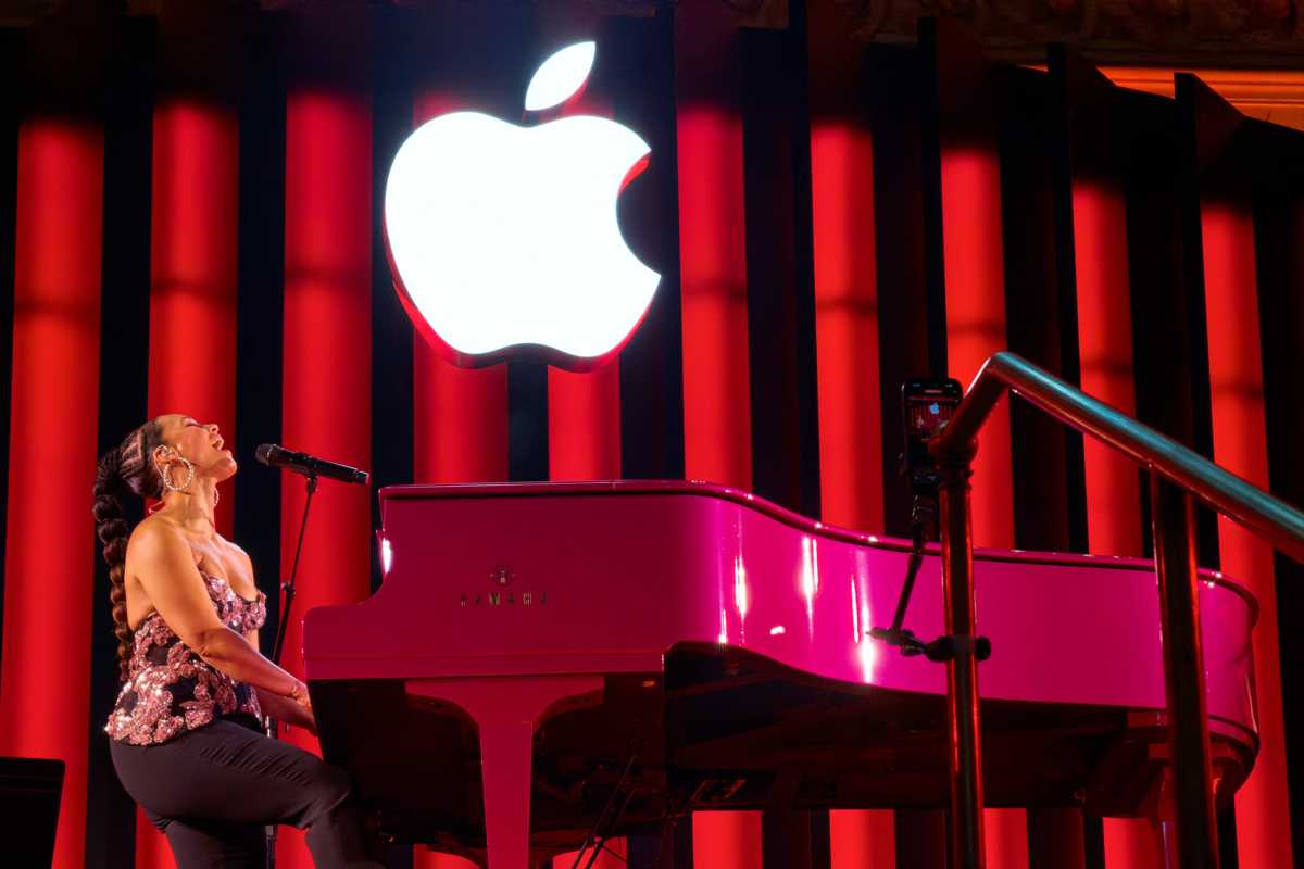 Alicia Keys playing piano during Apple Grand Central concert